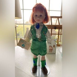 Red haired Girl Scout selling cookies. With stand